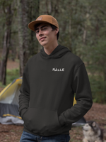 Man wearing black hoodie with Nalle logo camping.