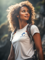 Woman wearing a white t-shirt with the Nalle logo on hiking 